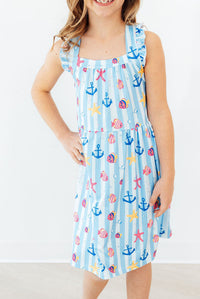 Girls light blue dress ruffle cross back with nautical print of anchors and seashells
