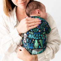 Mother hugs baby wearing The Second-Skin Footie in Mystic Mama Blue.