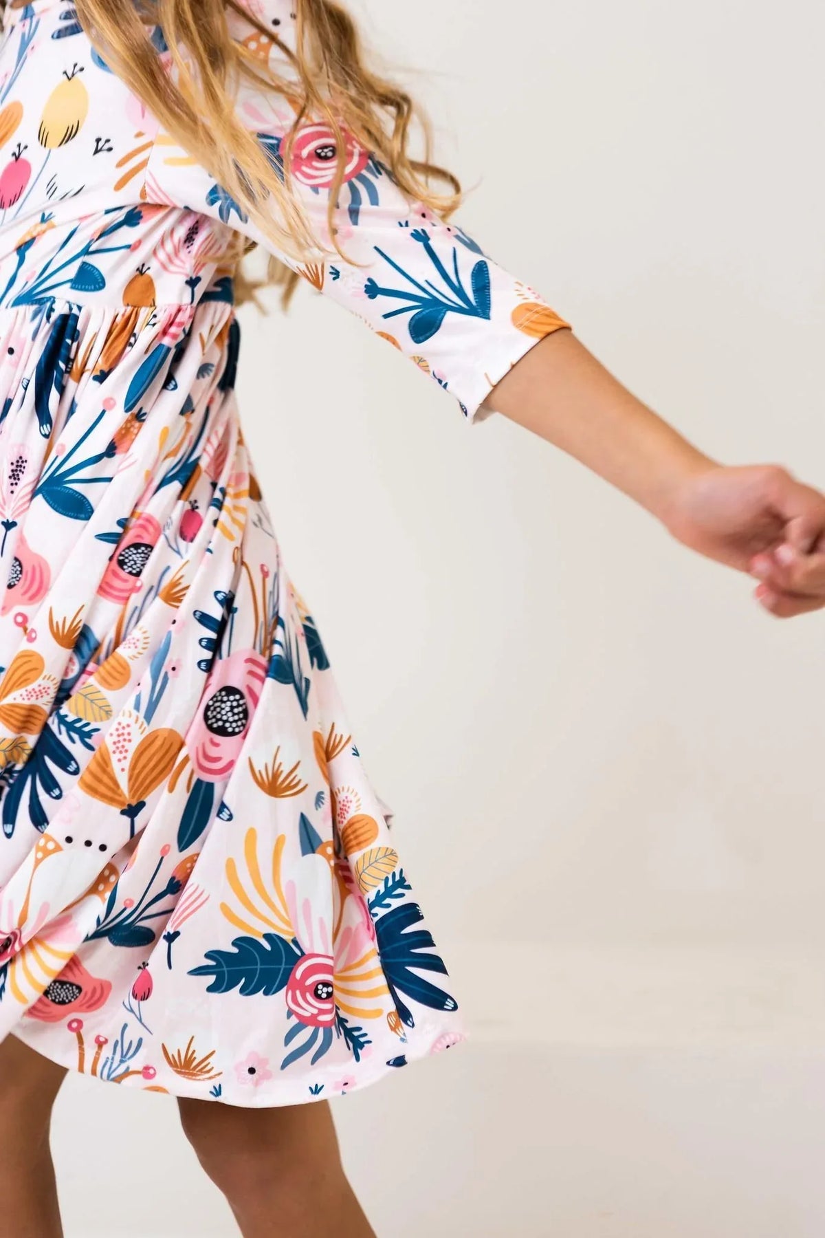 Blush peony girls twirl dress with 3/4 sleeves and floral pattern for toddlers by Mila & Rose