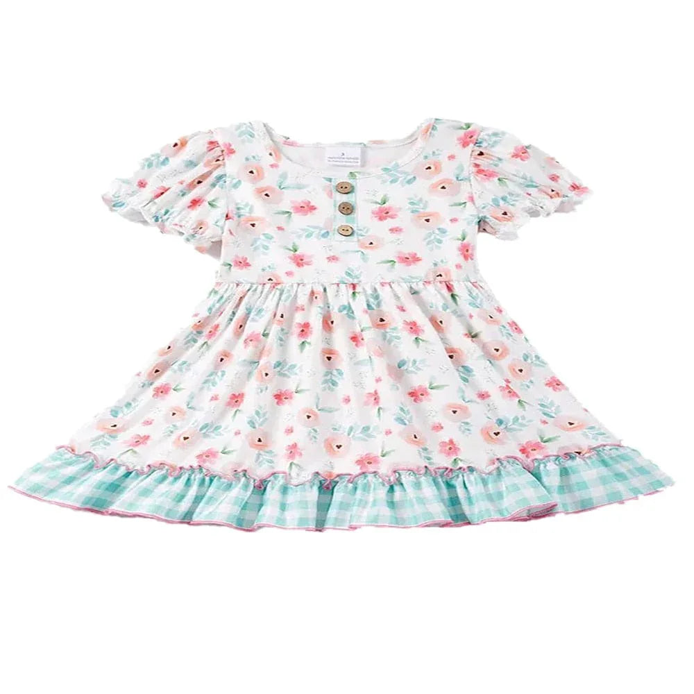 white boho floral dress for toddler girls with puff sleeves and green check ruffle hem
