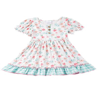 white boho floral dress for toddler girls with puff sleeves and green check ruffle hem