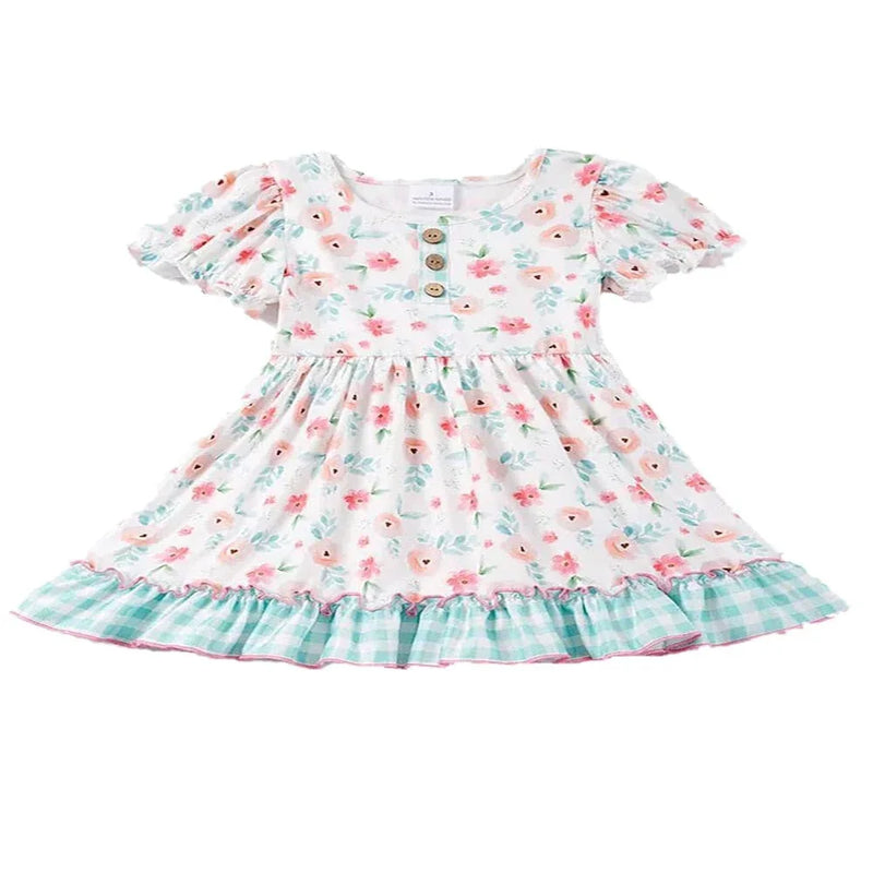 white boho floral dress for toddler girls with puff sleeves and green check ruffle hem