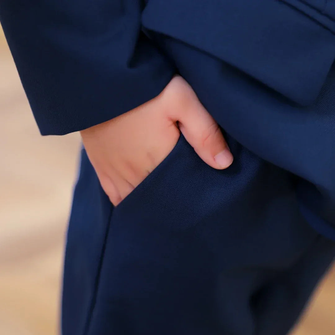 boys 3 piece suit with rose lapel in navy blue, toddler size, close-up of hand in pocket