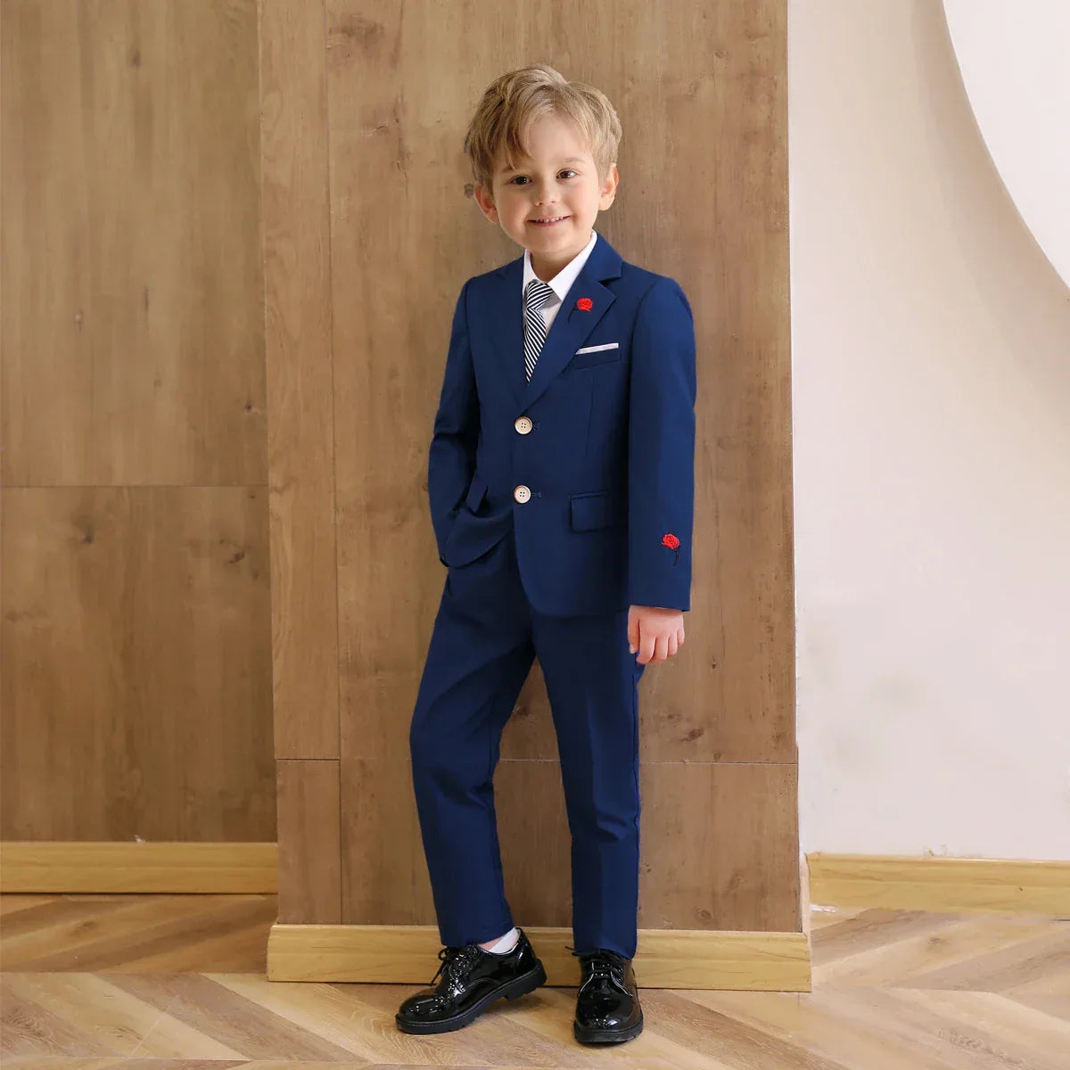 boys 3 piece suit with rose lapel in navy blue for young boys with white shirt and black shoes