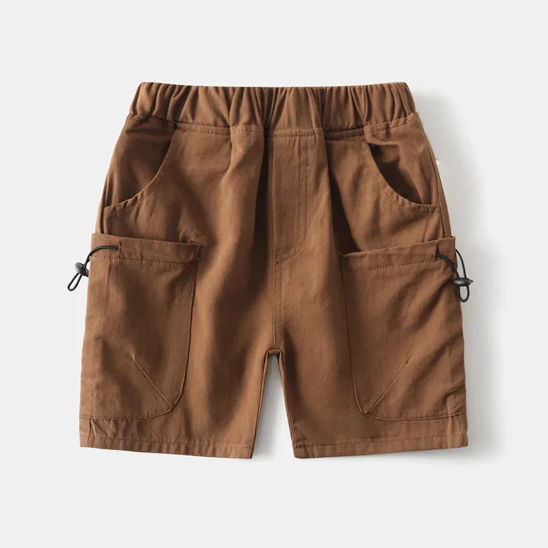 Brown boys cargo shorts with pockets for toddlers with elastic waistband on white background