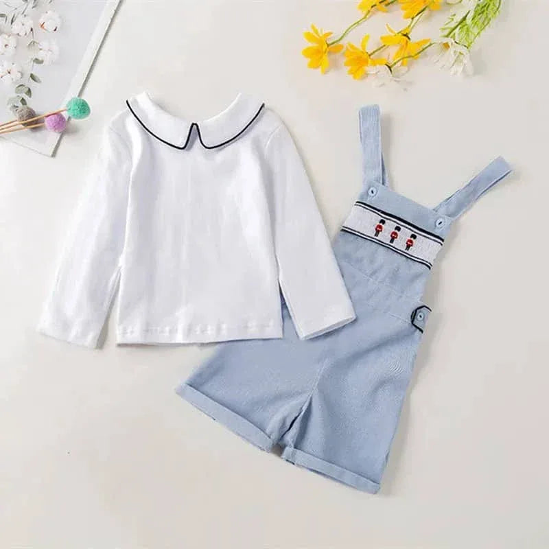 light blue boys embroidered romper set with a white long-sleeve shirt for toddlers displayed flat