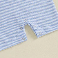 Close-up of light blue and white striped boys golf romper with snap buttons for easy diaper changes