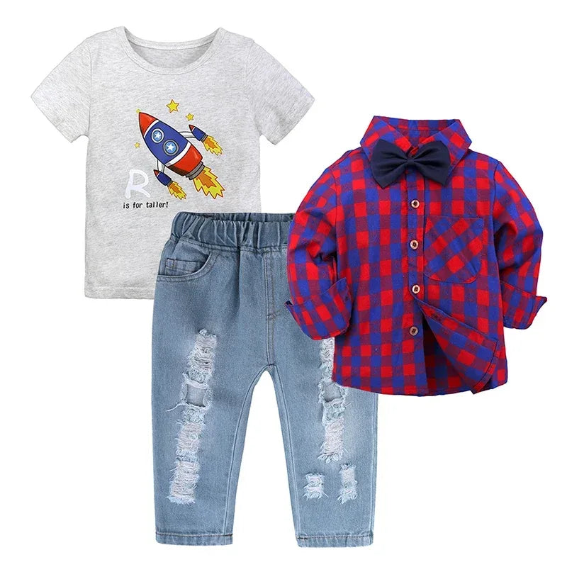 boys jean set with distressed jeans, gray rocket graphic t-shirt, and red blue checkered shirt with bow tie for toddlers
