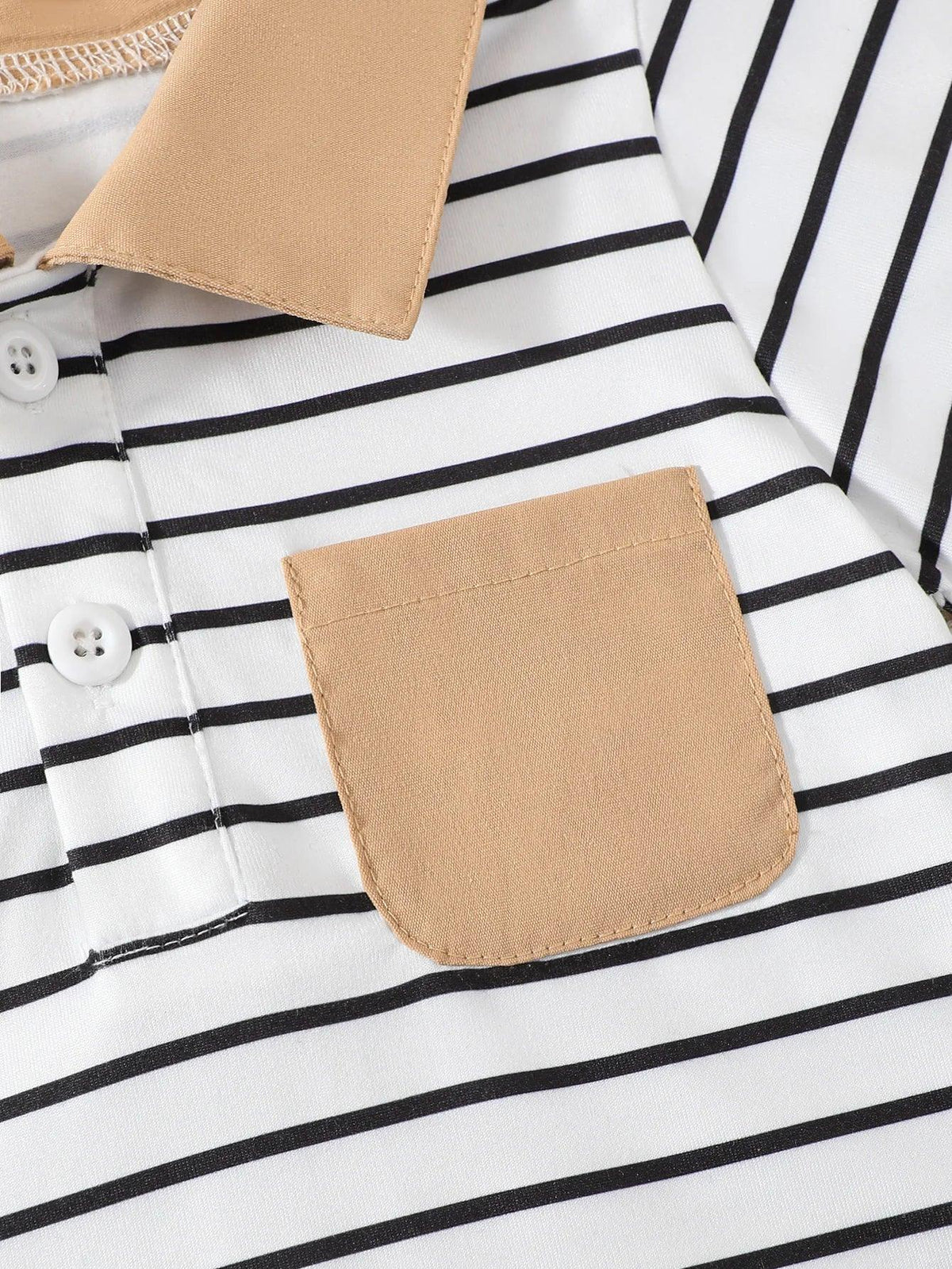 close-up of boys striped shorts outfit set with black and white stripes and tan collar pocket detail