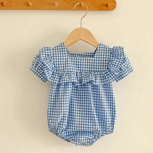 baby blue and white gingham bubble romper with puff sleeves and ruffle detail