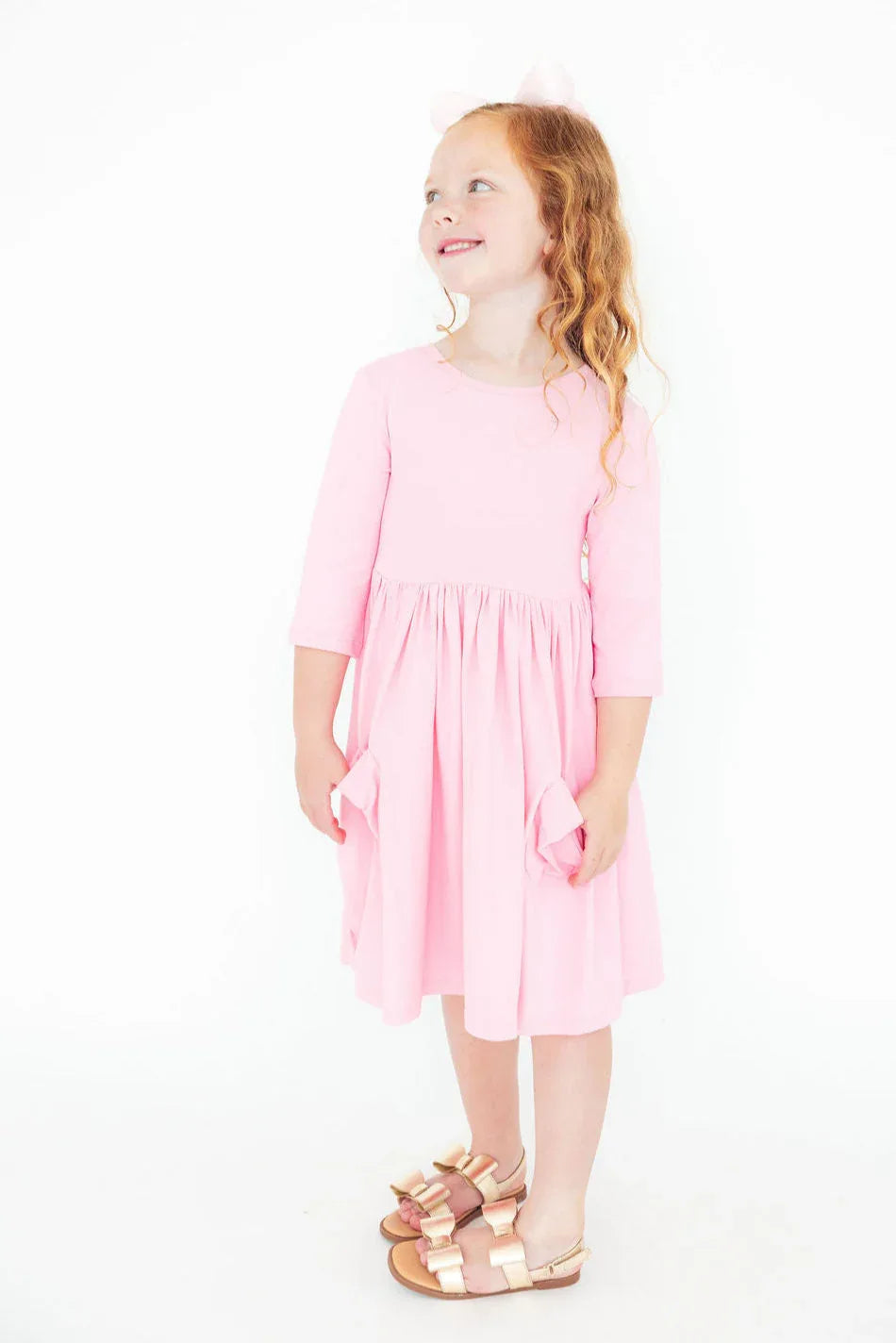 Bubblegum pink girls twirl dress Mila Rose with 3/4 sleeves and pockets for toddlers