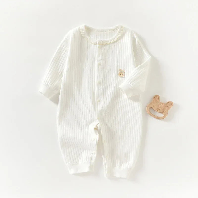white ribbed bunny baby romper for infants with long sleeves and small bunny patch