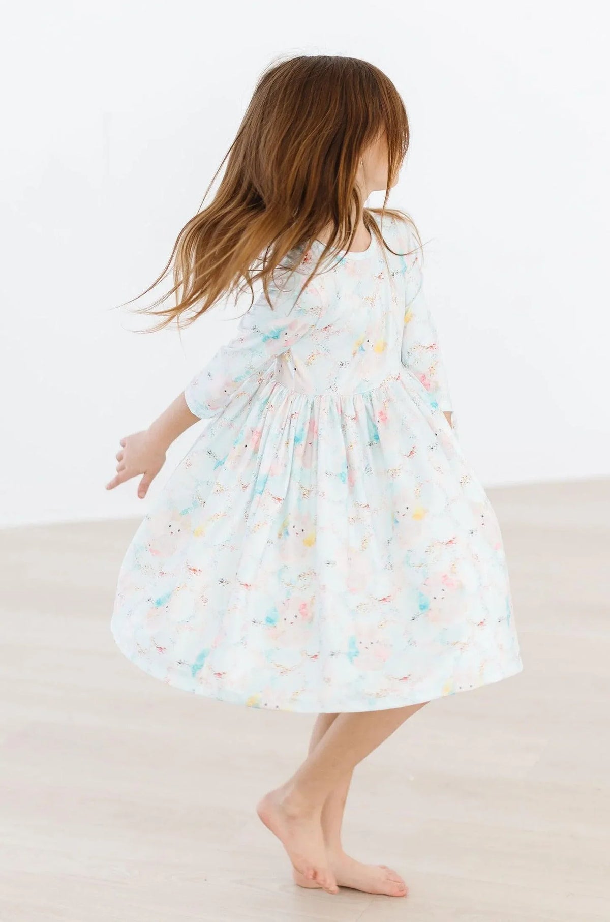 Girls light blue bunny print girls twirl dress by Mila Rose with 3/4 sleeves and pocket detail