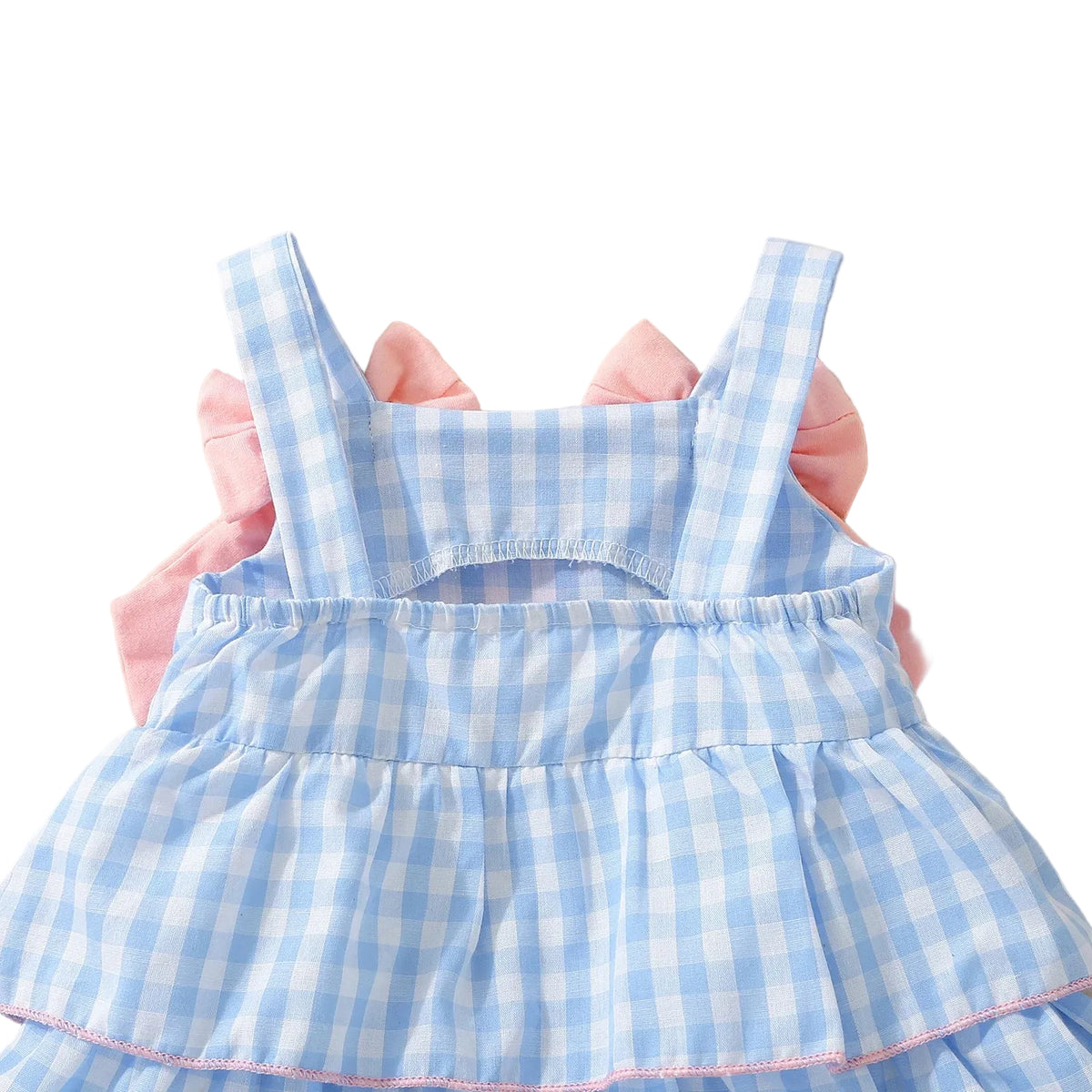 baby girls blue gingham dress with pink ruffle sleeves and sleeveless design