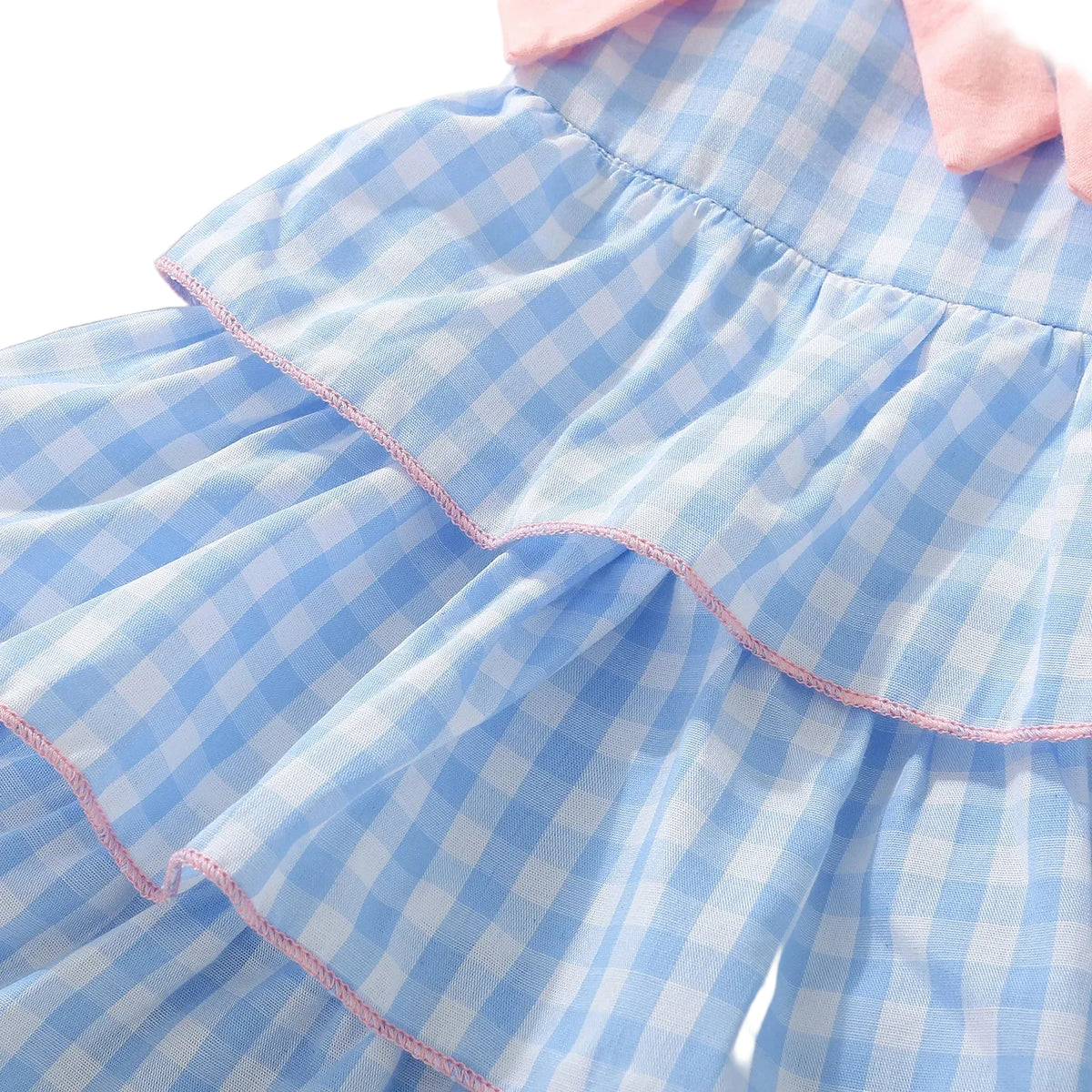 baby blue gingham dress with pink collar and pink trimmed ruffles for infants