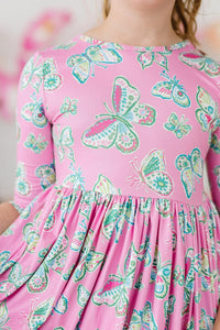 Girls pink butterfly twirl dress for girls by Mila & Rose with 3/4 sleeves and colorful butterfly print