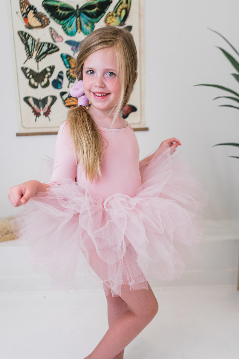 Close-up of the intricate layers of the Girl's Ballet Pink 3/4 Tutu Leotard, perfect for adding bounce to every twirl.