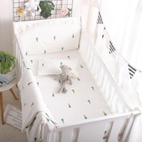 White cactus baby crib bedding set with green and orange cactus print for babies, includes pillow and blanket