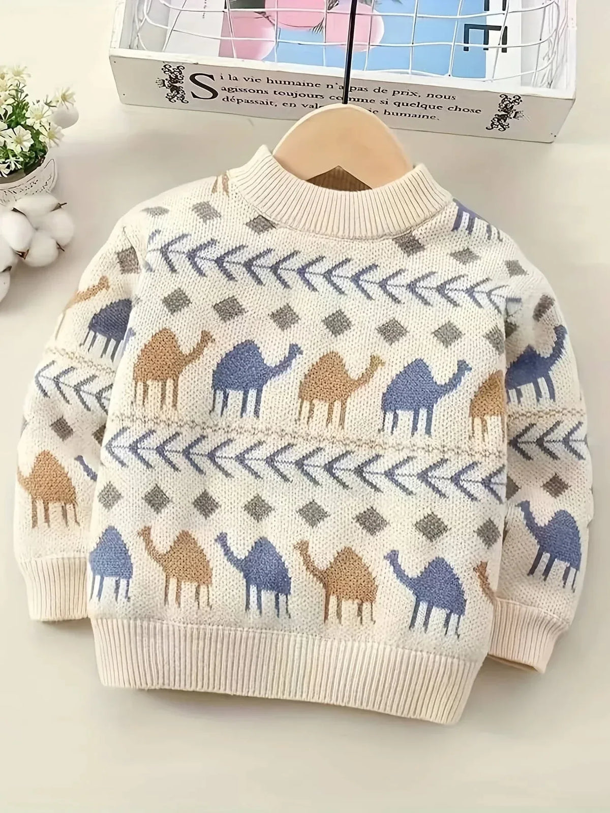 cream boys knit sweater with blue and brown camel pattern for toddlers