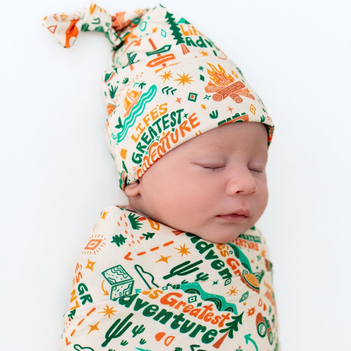 SoftKnot Cap Bamboo Newborn Cap in Adventuresome Wanderlust with vibrant hand-drawn print, perfect for stylish baby outfits.