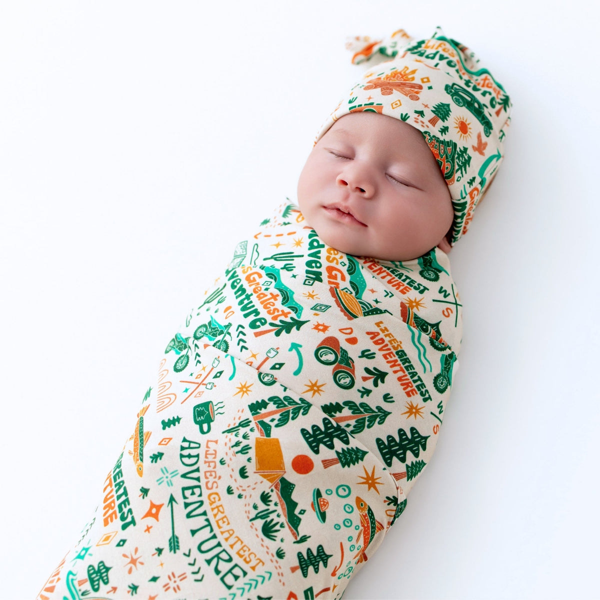 A mother nursing her baby while using The Forever Large Swaddle Blanket, emphasizing its role as a comfortable large swaddle blanket for feeding.