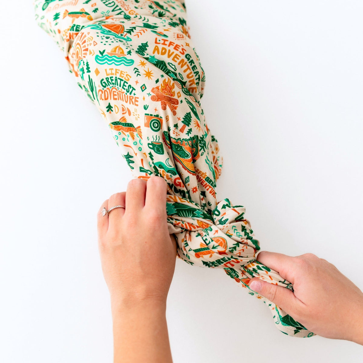 The Forever Large Swaddle Blanket used as a stroller cover during a lovely outing, showcasing its multi-use function as a large swaddle blanket.