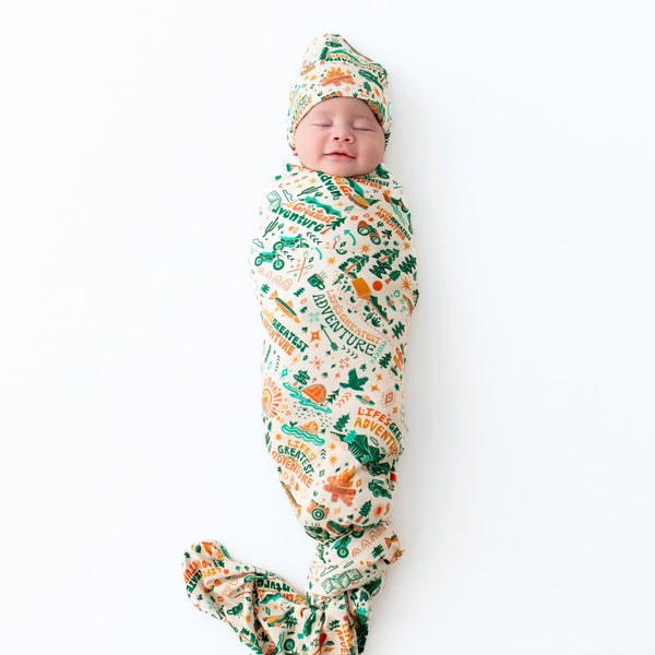 The Forever Large Swaddle Blanket in Colorful Wanderlust, a large swaddle blanket perfect for cozy moments with your baby.