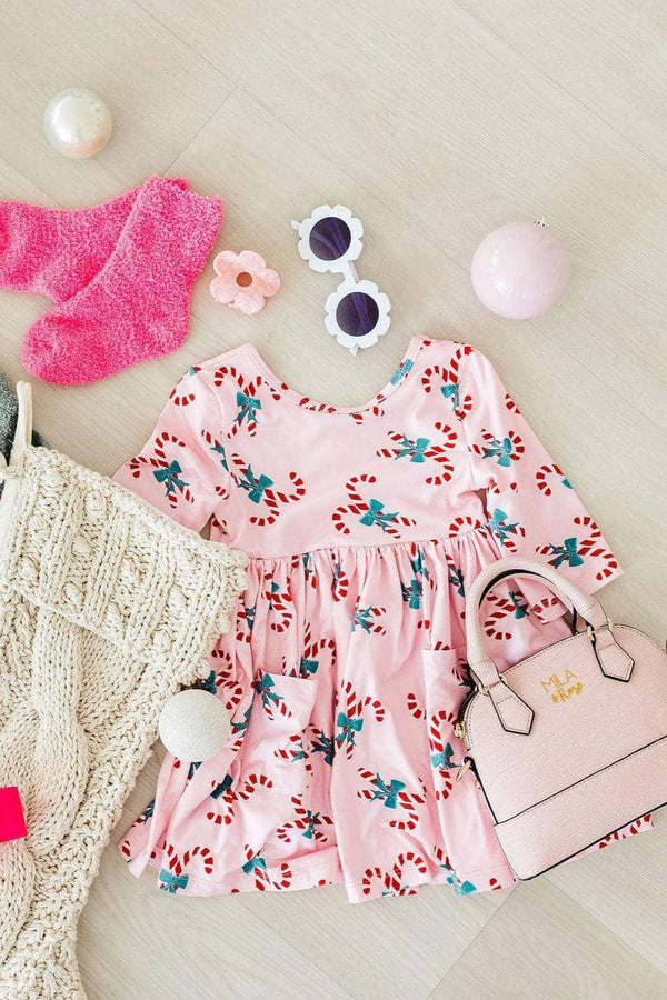 Girls pink candy cane dress for girls with 3/4 sleeves and twirl pocket by Mila Rose