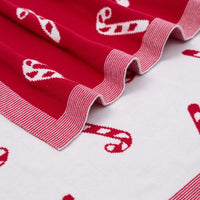 Close up of double-knit cotton texture and ribbed border contrasting red and white sides
