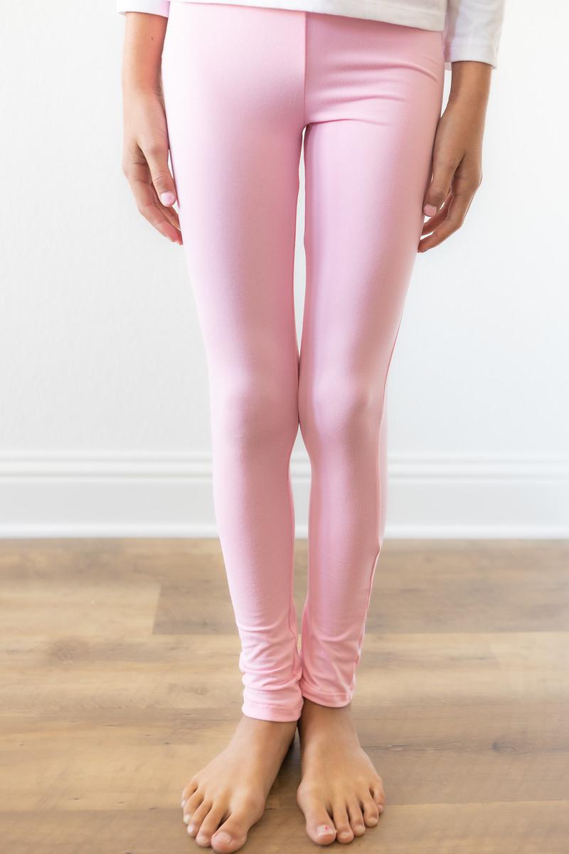 Close-up of Bubblegum Pink Leggings on a girl, highlighting the soft material and stylish high-waisted design.