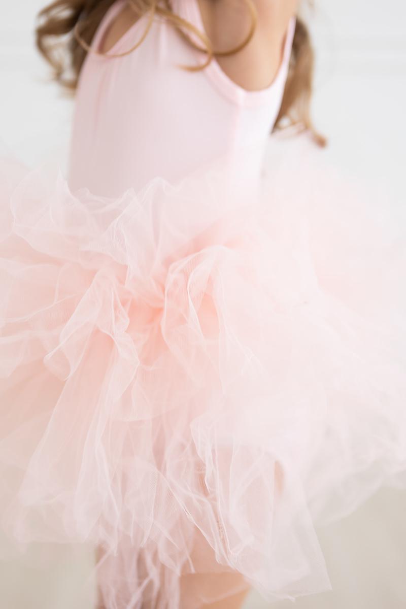 Beautiful close-up showing the fluffy layers of the 'Elana' Ballet Pink Tank Tutu Leotard, designed for maximum fluffiness.