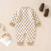 Beige and white checkered baby romper for infants with long sleeves and ribbed cuffs