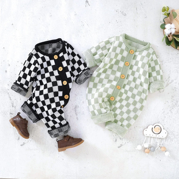 checkered baby romper in black and white and green and white for infants with wooden buttons and long sleeves