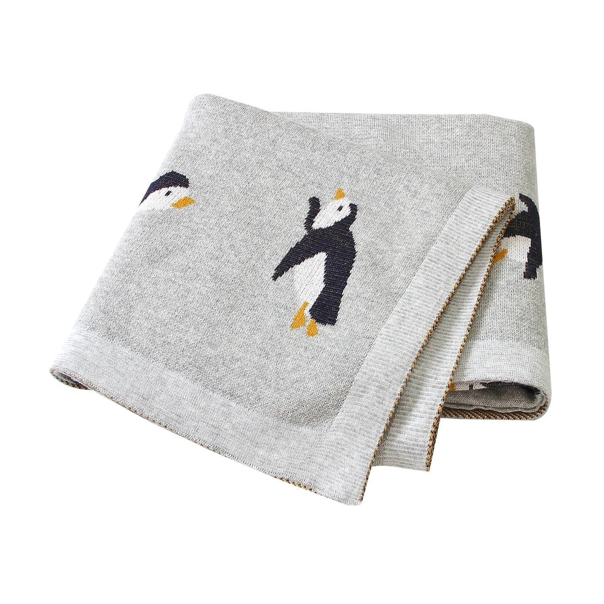 Gray childrens knit penguin blanket with black and white penguin design for babies and kids