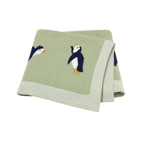 childrens knit penguin blanket in soft green with navy and white penguin design for babies and kids