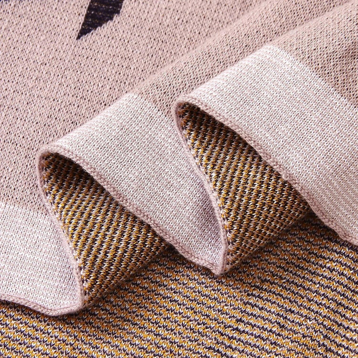 Childrens knit penguin blanket in soft beige with brown and white accents, suitable for infants and toddlers