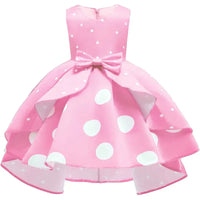 Girls pink childrens party dress with white polka dots and bow detail, toddler size