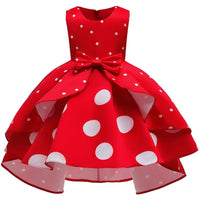 Red sleeveless childrens party dress with white polka dots and bow for girls