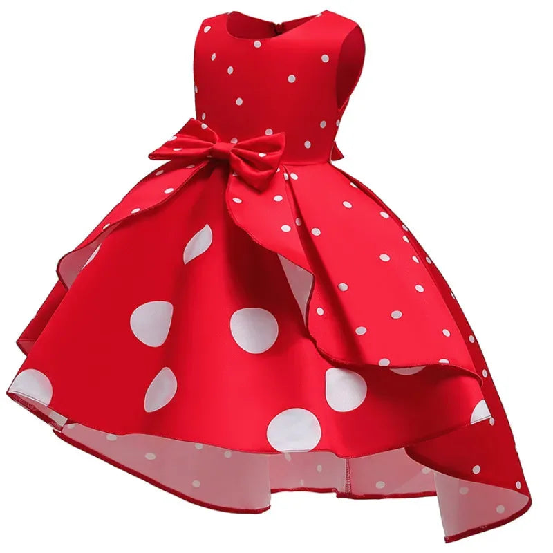 Red sleeveless childrens party dress for girls with white polka dots and bow detail