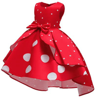 Red sleeveless childrens party dress for girls with white polka dots and bow detail