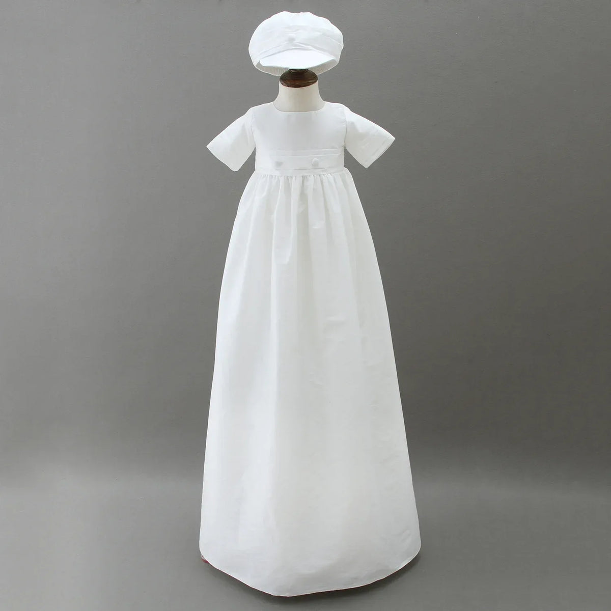 white christening gown for boys with short sleeves and matching white hat for infants