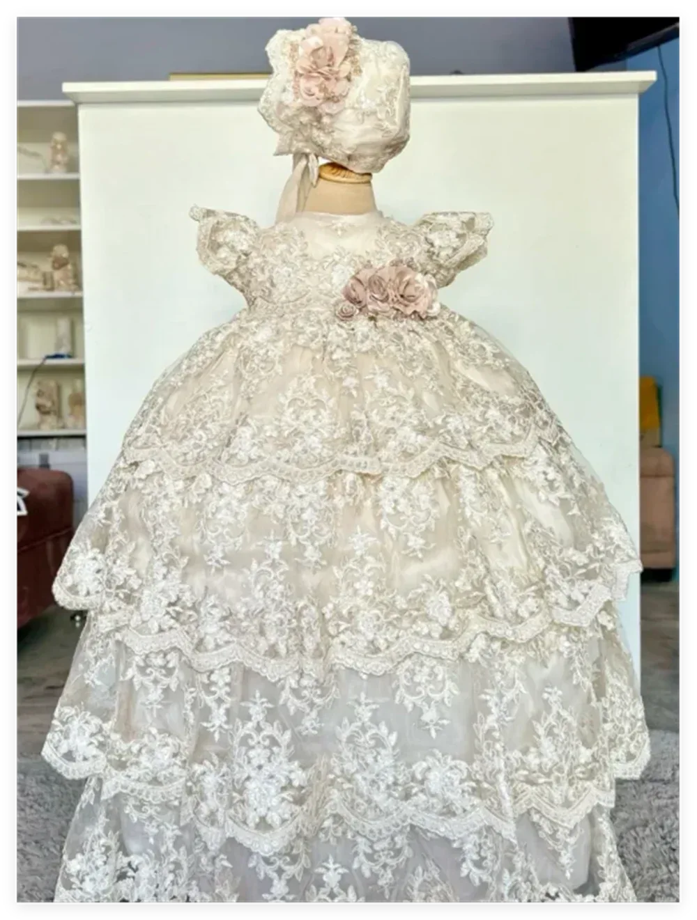 Ivory christening long gown for babies with lace design and matching bonnet, elegant floral details