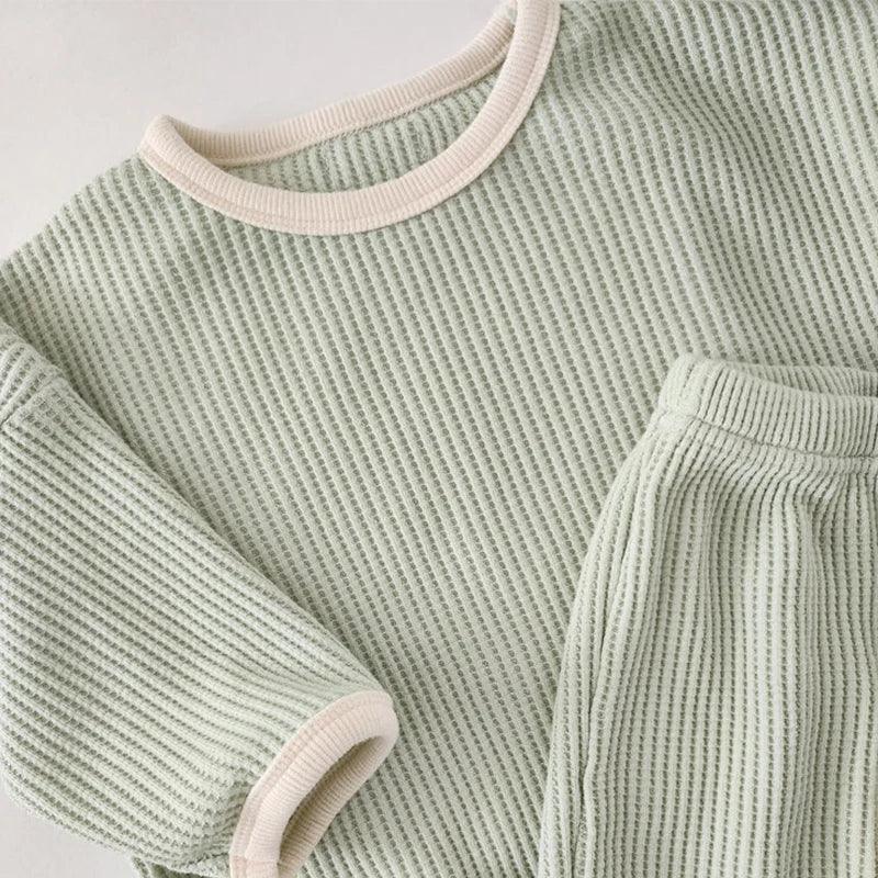 Baby green waffle knit warm up outfit with cream trim, long sleeve top and pants