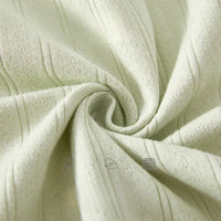 cream cotton baby romper long sleeve fabric close-up with ribbed texture for newborns