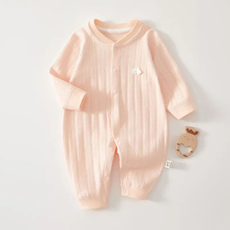 Peach cotton baby romper long sleeve for newborns with ribbed texture and small white cloud detail