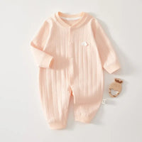 Peach cotton baby romper long sleeve for newborns with ribbed texture and small white cloud detail