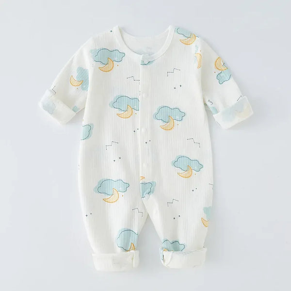 White cotton baby romper with snaps featuring blue clouds and yellow moons pattern