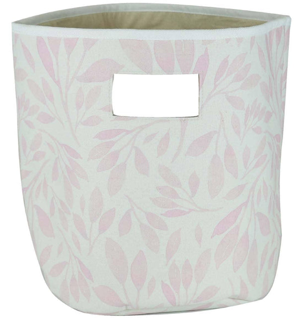 Pink and white fabric baby storage bins with leaf pattern and handle cutout for nursery organization