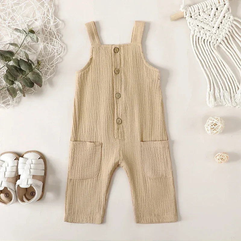 beige cotton kids overalls romper for toddlers with front buttons and large pockets