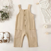 beige cotton kids overalls romper for toddlers with front buttons and large pockets